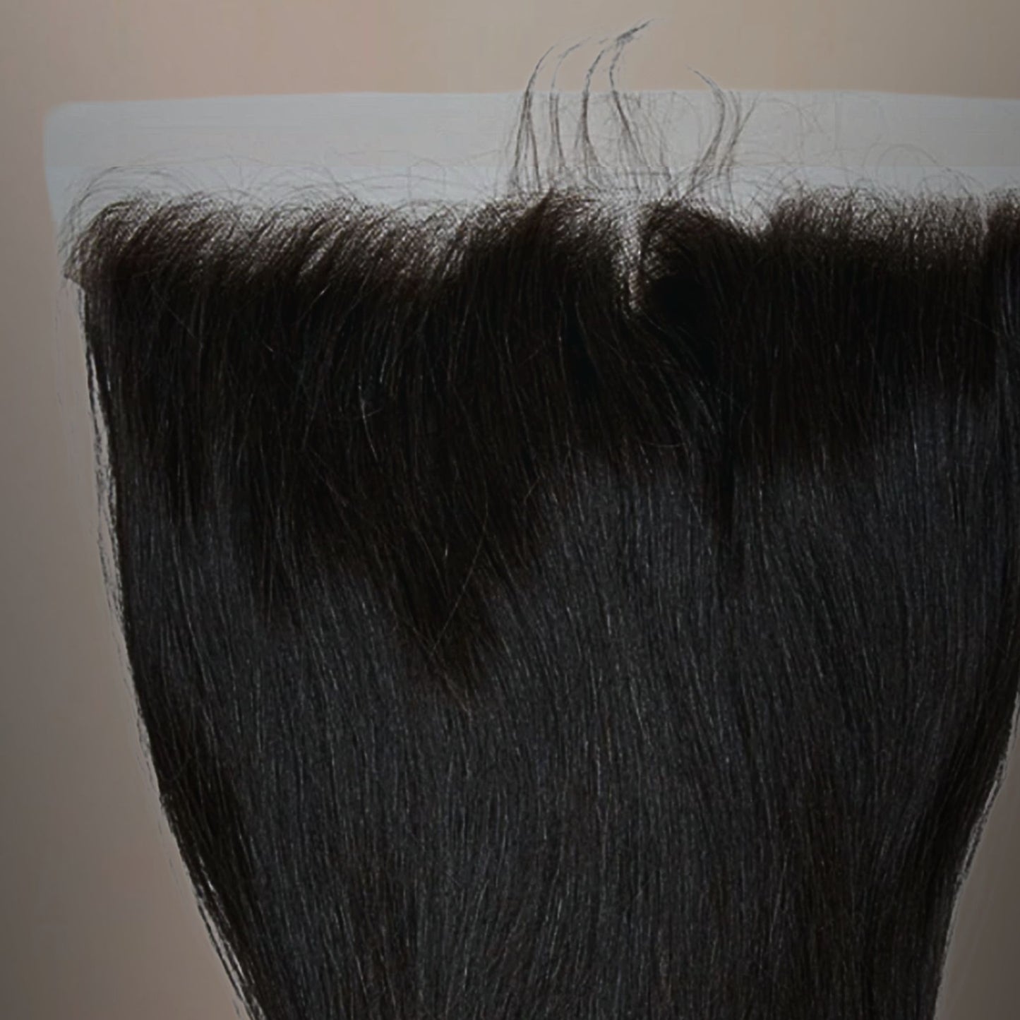 Close-up of Cambodian straight 13x4 HD frontal lace, highlighting the natural hairline and seamless blend for an undetectable finish.