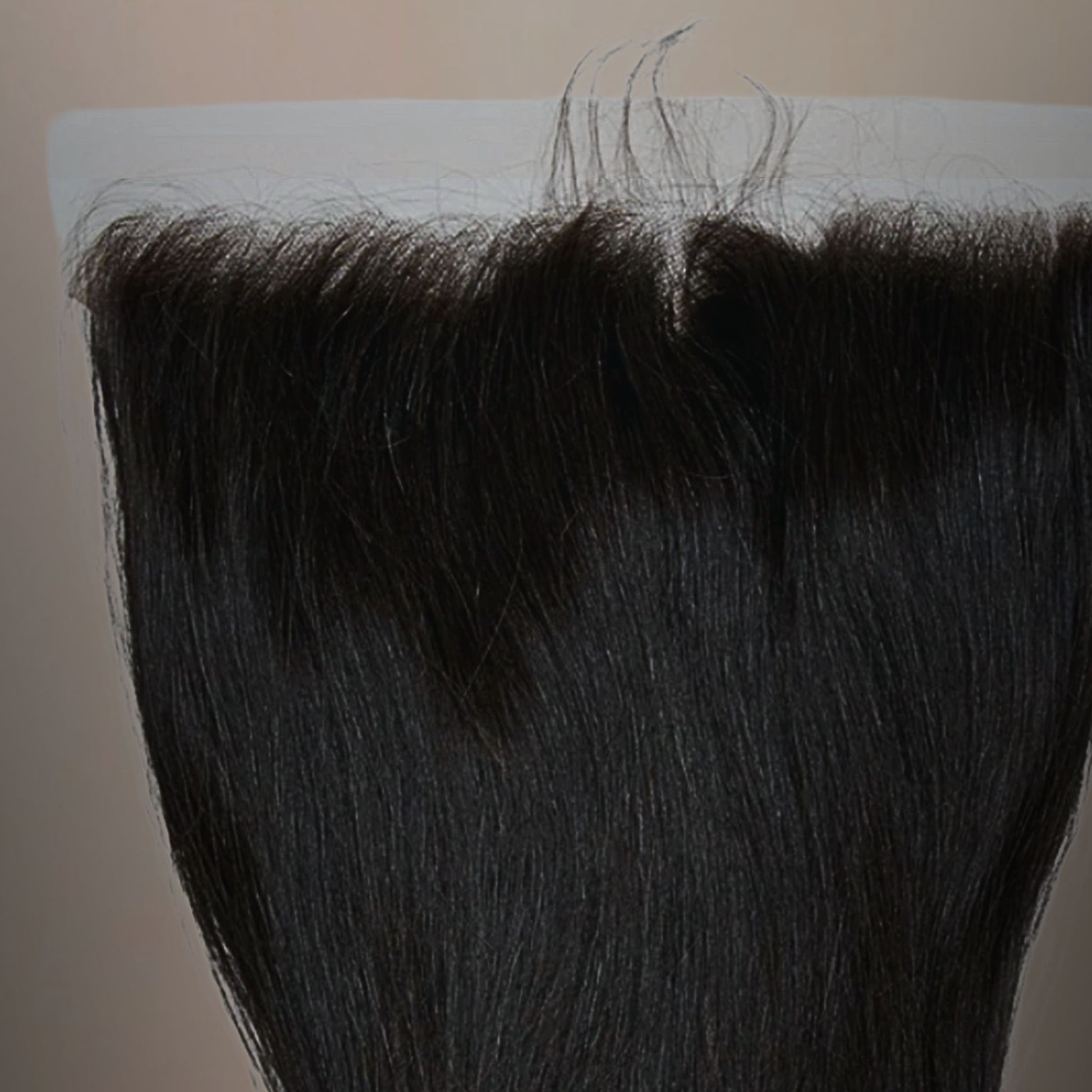 Close-up of Cambodian straight 13x4 HD frontal lace, highlighting the natural hairline and seamless blend for an undetectable finish.