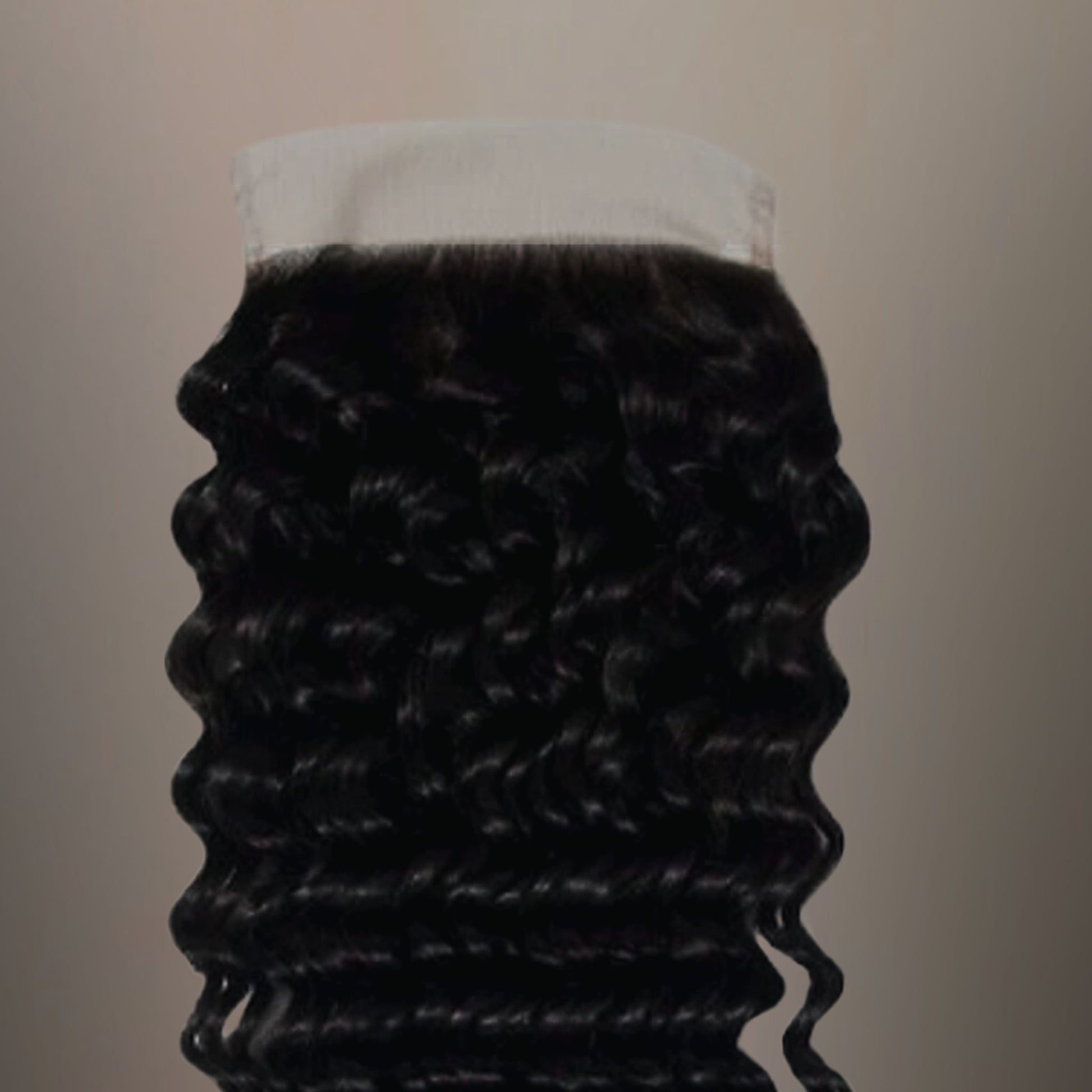 Close-up of Raw Indian Deep Wave 5x5 HD Closure, showing the intricate lace details and voluminous wave texture.