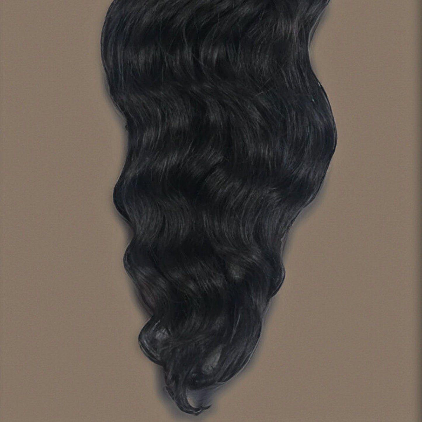 Close-up of Virgin Cambodian Body Wave hair extensions, highlighting the soft waves, silky texture, and natural shine.